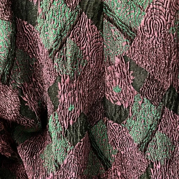 Skirt waistband is elastic colors purple &green. Skirt is below the knee midi - Picture 6 of 7